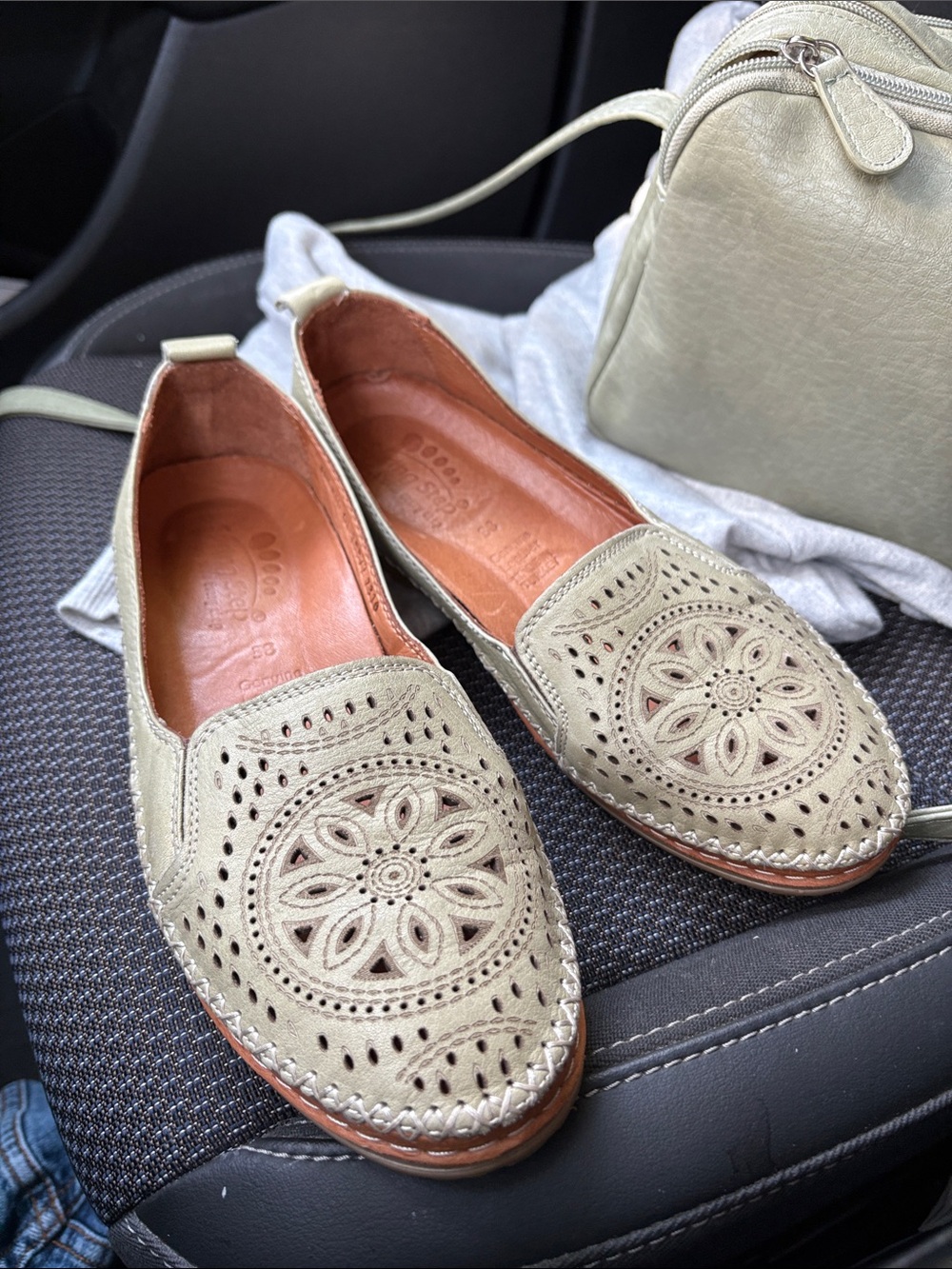 Spring step Sage Green Slip-Ons with intricate design.